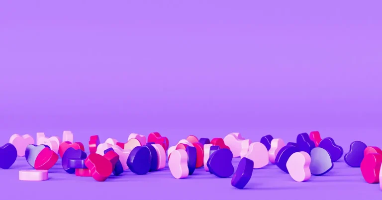 Formes colorées en cœurs sur fond violet, représentant des idées dynamiques et captivantes pour rédiger des titres d’articles de blog efficaces.